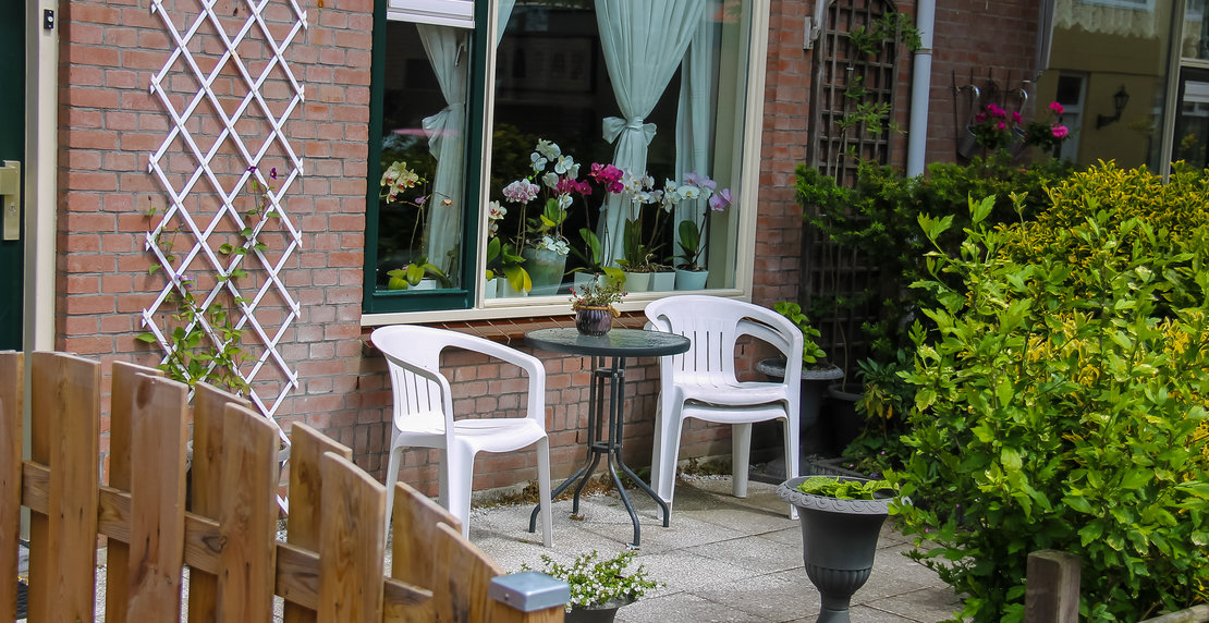 Street view of traditional house decorated with plants and furniture in Zandvoort, the Netherlands