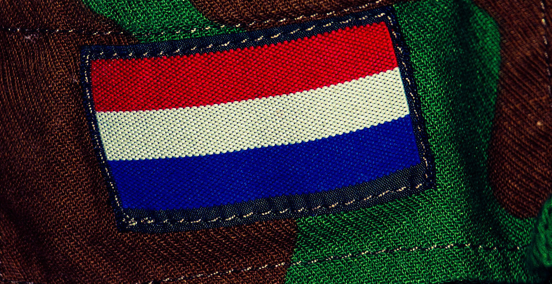Close-Up Of Netherlands Flag On Military Uniform